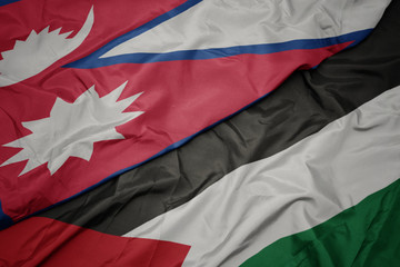 waving colorful flag of palestine and national flag of nepal.