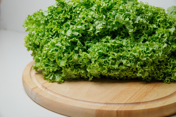 Fresh lettuce salad leaves bunch isolated on white background cutout