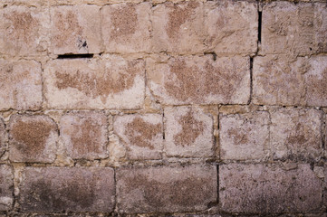 Old white brick. Brickwork. Old brickwork. The wall is built of white brick. Architectural texture. Silicate brick. Dirt on the wall.