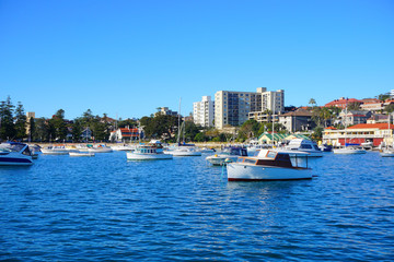 Boats on Sydney Harbour with blue skies