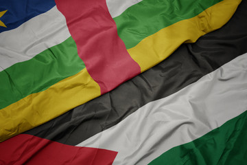 Obraz premium waving colorful flag of palestine and national flag of central african republic.