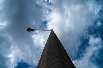 Streetlight and cloudy skies