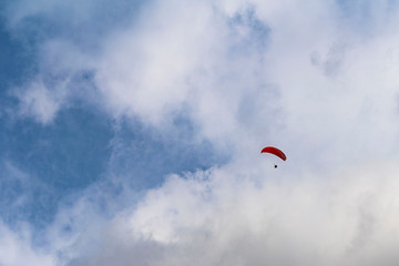 Tandem flight high up in the sky with a few clouds