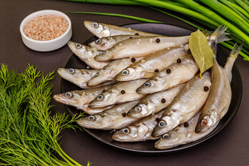 Fresh raw sea fish smelt or sardines ready for cooking