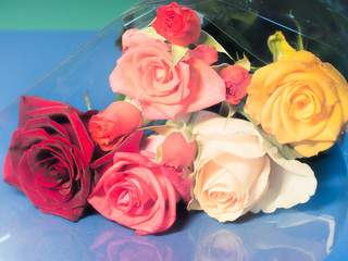 bouquet of roses on desk retro style
