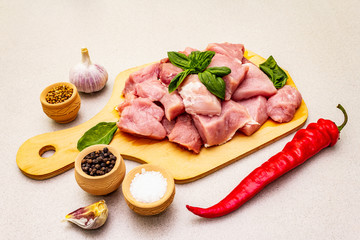 Raw pork neck, cut into pieces with fresh vegetables and dry spice