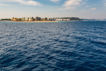 Fototapeta premium Views of the island of Rhodes while walking on a ship on the Aegean Sea.