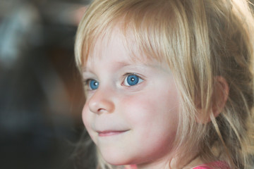 close up, portrait of 3 years old blonde happy toddler girl with big blue eyes 