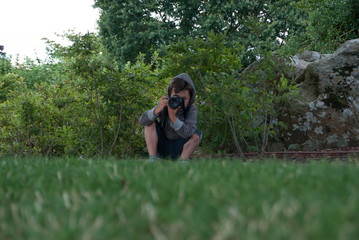 Little boy squatting doing a picture