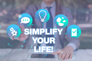 Text sign showing Simplify Your Life. Business photo showcasing focused on important and let someone else worry about less ones Female human wear formal work suit presenting presentation use smart