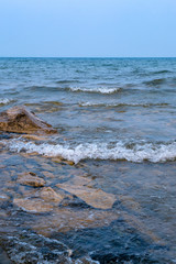 Fototapeta premium wave on the lake in cloudy weather