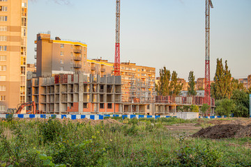 construction.construction of a house behind the fence