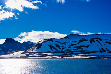 Glacier heading down from a mountain range into the Arctic Ocean, Hornsund, Norway