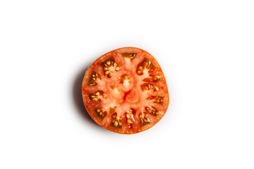 Fototapeta na wymiar A piece of tomato top view on a white background isolated