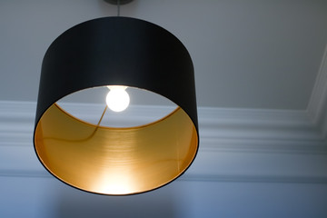 Golden lamp in a room, elegant modern home decor lighting