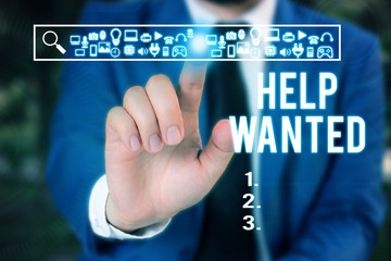 Word writing text Help Wanted. Business photo showcasing An ad in the paper an employer places to find a new employee Male human wear formal work suit presenting presentation using smart device