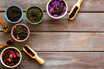 different tea for brew frame on wooden background top view