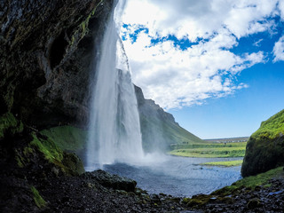 View of Seljalandsfoss Waterfall, tourist popular natural attraction in Iceland