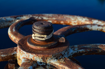 Rustic industrial wheel bathed in sunlight