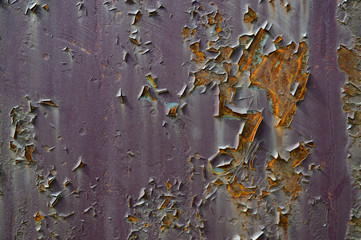 Paint peeling to reveal rust underneath