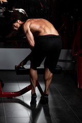 Fototapeta na wymiar Middle Age Man Bodybuilder Flexing Calves