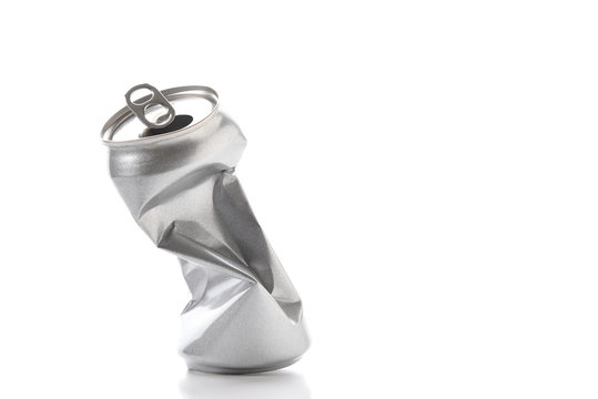 Closeup of a crushed empty beverage can with no label.