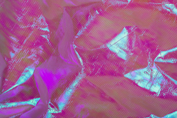 Bright holographic foil background. Multicolor trendy backdrop.