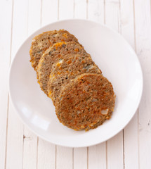 quinoa vegetable burger on white dish