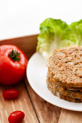 quinoa vegetable burger with  tomato 
