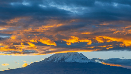 The Chimborazo volcano and Andes mountain peak at sunset is the highest peak of Ecuador located near Riobamba city, South America.