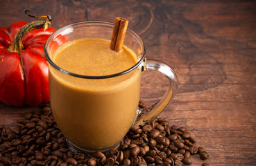 A Pumpkin Spice Latte on a Rustic Wooden Table