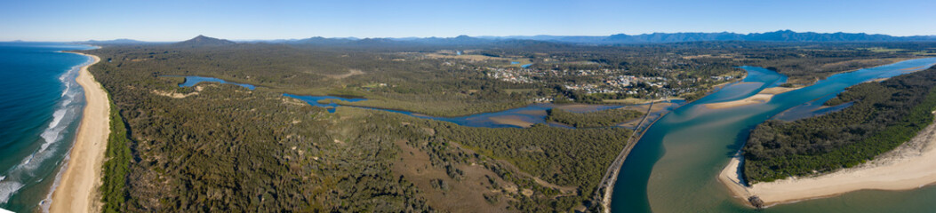 Obraz premium Urunga, NSW, where the Bellinger and Kalang rivers meet and empty into the pacific ocean.