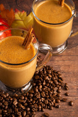 A Pumpkin Spice Latte on a Rustic Wooden Table