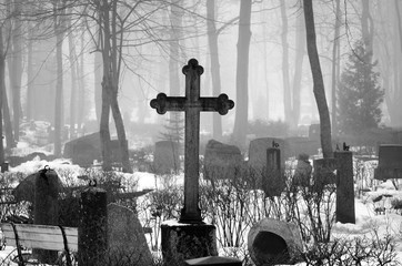 cross in fog at the cemetery