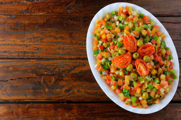 Vinagrete or Vinaigrette is a traditional Brazilian cuisine salad made with tomatoes, peppers, onions, vinegar, parsley and olives.