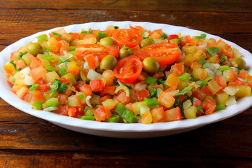 Vinagrete or Vinaigrette is a traditional Brazilian cuisine salad made with tomatoes, peppers, onions, vinegar, parsley and olives.