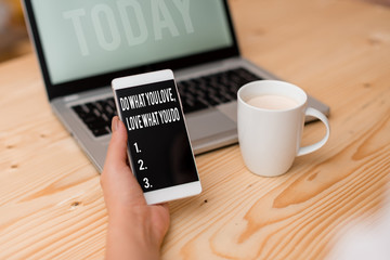 Word writing text Do What You Love Love What You Do. Business photo showcasing you able doing stuff you enjoy it to work in better places then woman laptop computer smartphone mug office supplies
