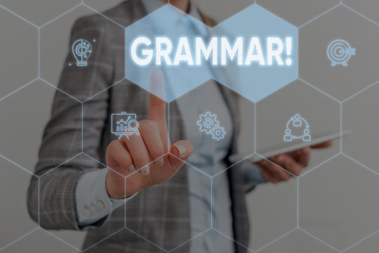 Conceptual hand writing showing Grammar. Concept meaning whole system structure language syntax and morphology Woman wear work suit presenting presentation smart device