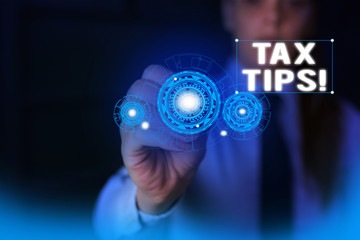 Text sign showing Tax Tips. Business photo showcasing compulsory contribution to state revenue levied by government Woman wear formal work suit presenting presentation using smart device