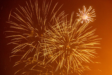 Fireworks exploding against a night sky, at Lewes bonfire celebrations