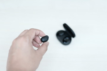 Black wireless bluetooth headphones on the table
