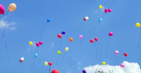 multicolored balls launched in the blue sky