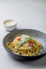 spaghetti Oli Olio on white concrete table