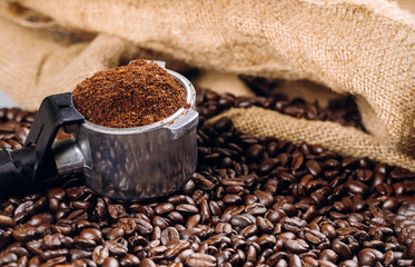 An espresso filled with top view of portafilter with coffee beans