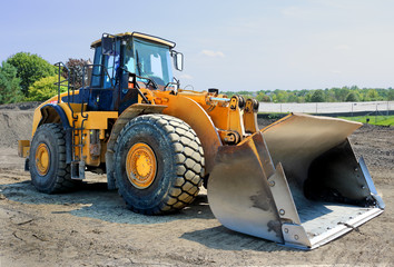 Obraz na płótnie Canvas large yellow eath moving bulldozer