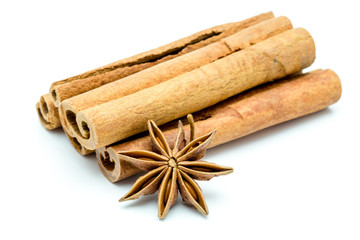 Closed up of anise and cinnamon sticks on white isolated background.