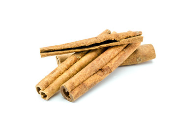 Closed up of anise and cinnamon sticks on white isolated background.