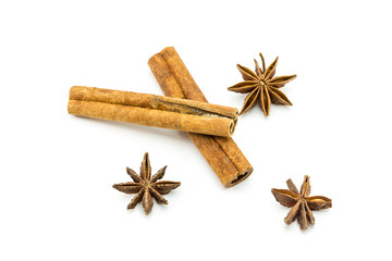 Closed up of anise and cinnamon sticks on white isolated background.