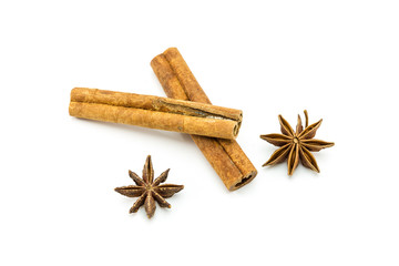 Closed up of anise and cinnamon sticks on white isolated background.