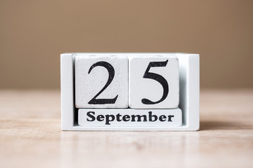 25 September of calendar wooden on table, World pharmacist day concept